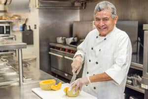 a chef in the kitchen of the Aviara Healthcare