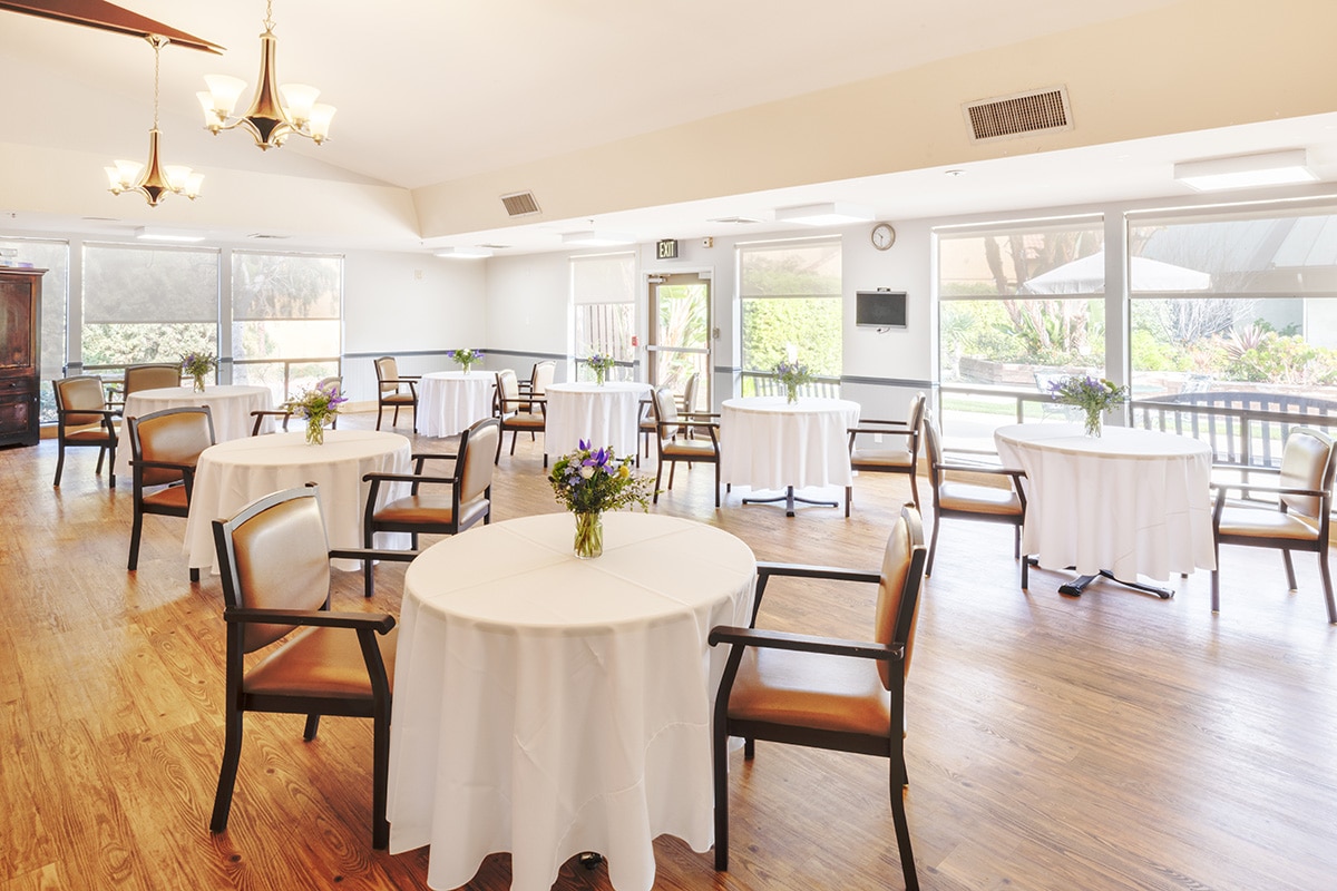 linen tablecloths the dining area of the Aviara Healthcare