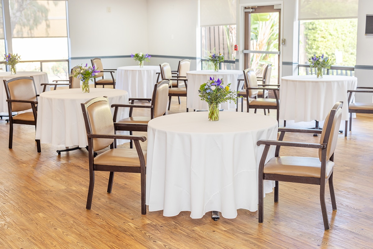 linen tablecloths the dining area of the Aviara Healthcare